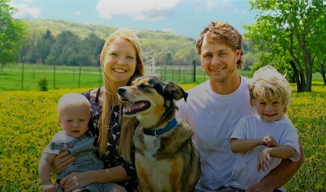 Happy family with dog in the park